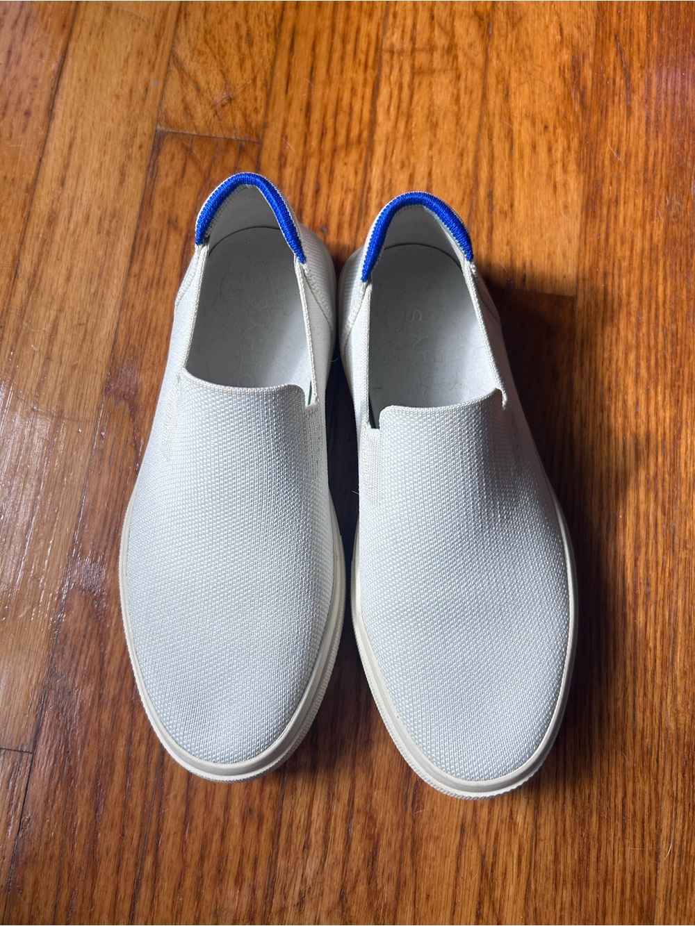 Rothy's Slip-On Sneakers in Off-White with Blue Heel Trim